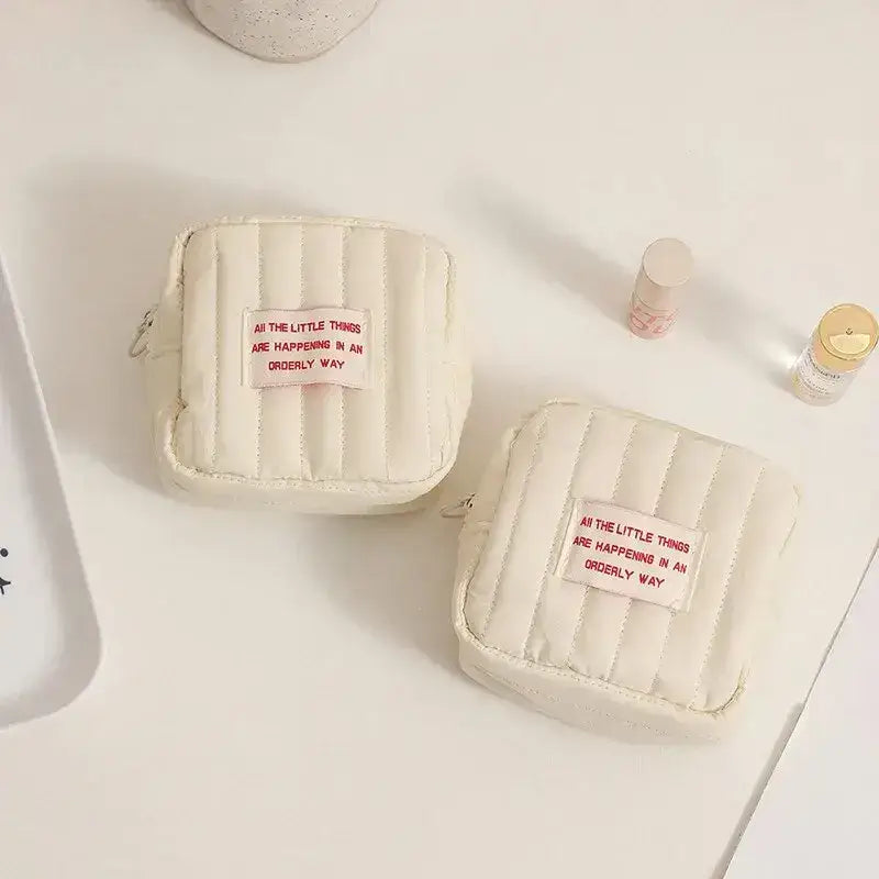 Two off-white quilted pouches from the Creamy Quilted Korean Square Small Makeup Bag