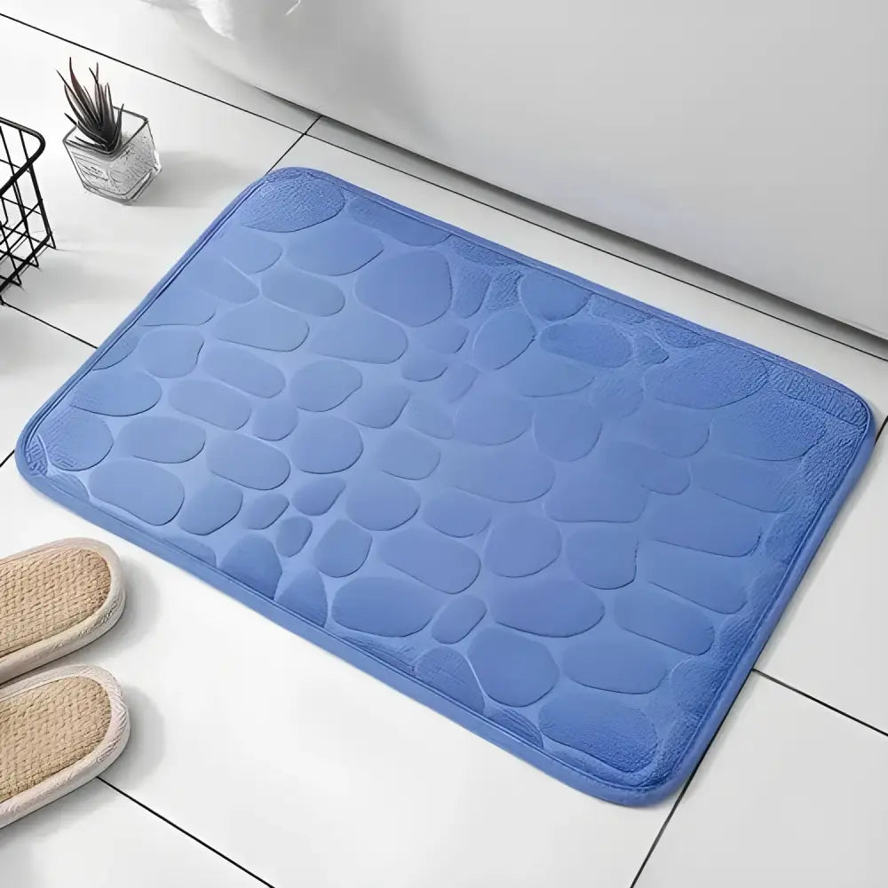 Blue pebble-patterned Cushy Embossed Velvet Bath Mat, a cozy memory foam embossed upgrade