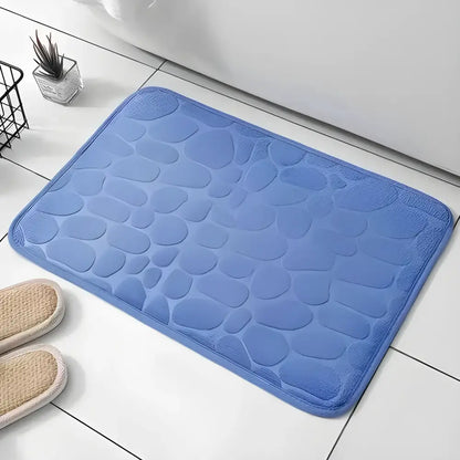 Blue pebble-patterned Cushy Embossed Velvet Bath Mat, a cozy memory foam embossed upgrade