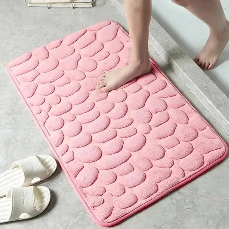 Pink pebble-textured Cushy Embossed Velvet Bath Mat in memory foam embossed design