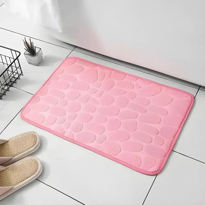 Cushy Embossed Velvet Pebble Bath Mat in pink with memory foam embossed design