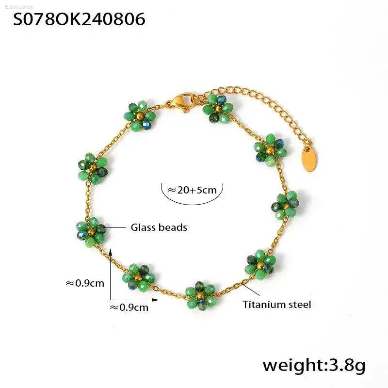 Gold-toned flower bead bracelet.