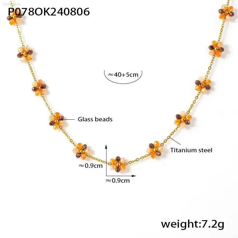 Gold-toned floral beaded necklace.