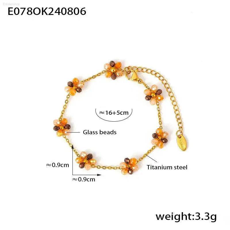 Gold-toned flower bead bracelet.