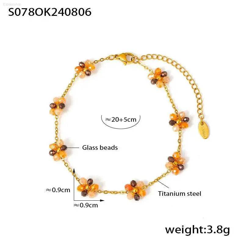 Gold-toned flower bead bracelet.