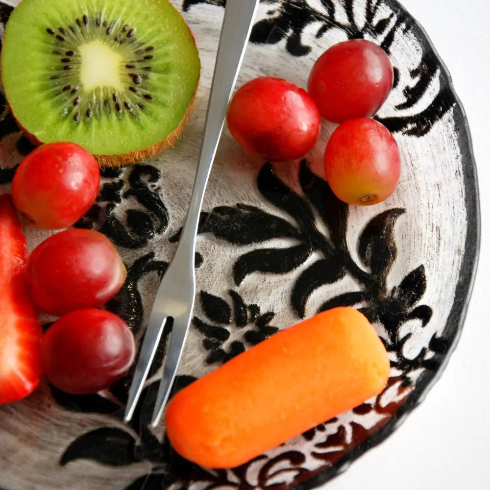 Fruit and vegetable plate on a Damask Black Velvet Gilded Glass Canapé Plate