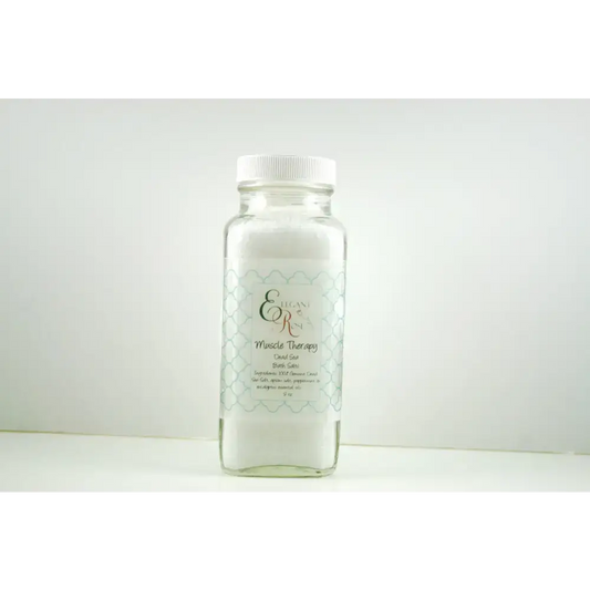 Clear bottle of Dead Sea Muscle Therapy Gel with relaxing sea bath salts inside