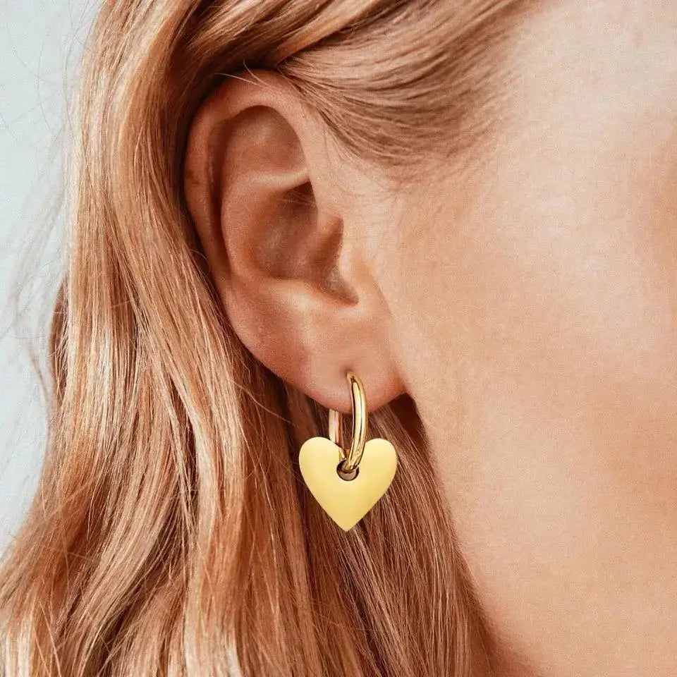 Gold heart hoop earring from Dee Heart Earring is perfect for expressing love