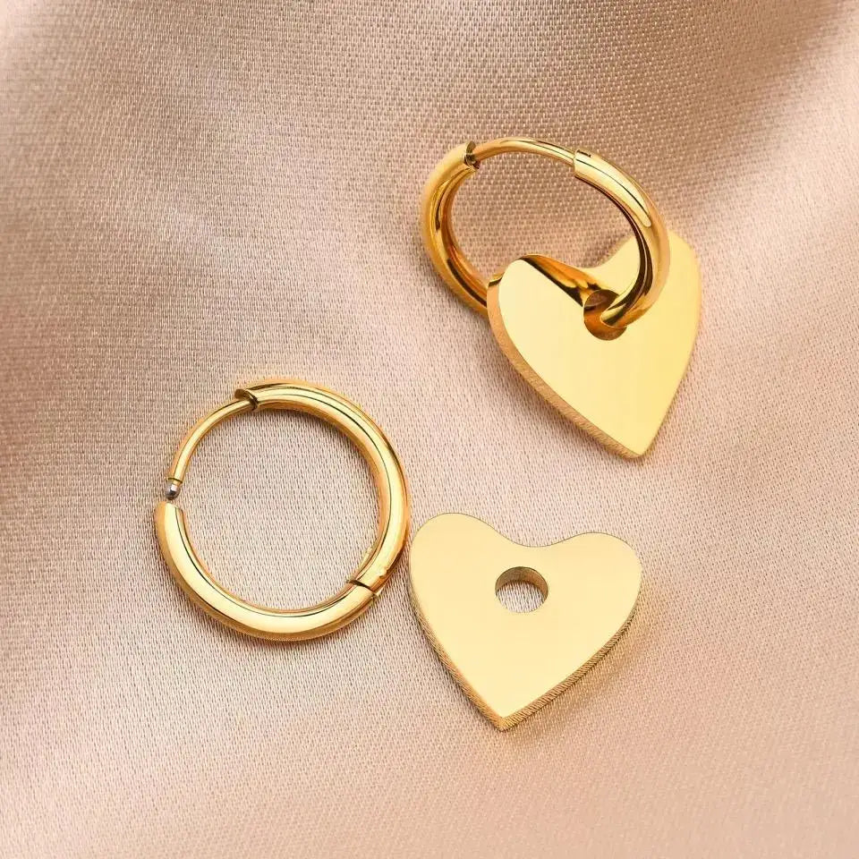 Gold heart-shaped earrings from Dee Heart Earring, perfect for expressing love