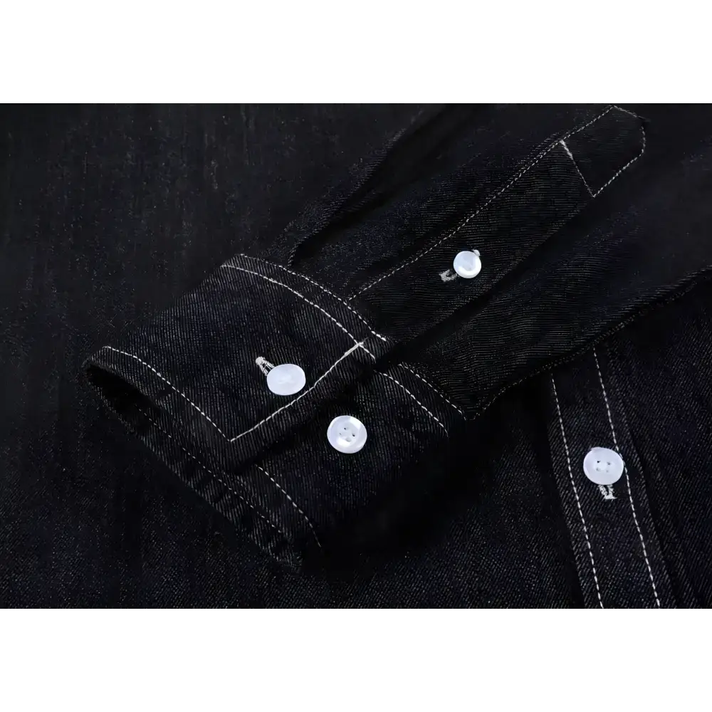 Black denim shirt sleeve with white buttons, perfect for a stylish mens long sleeve look