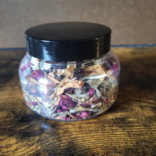 Jar of dried herbs and flowers for Divine Beauty Bath Tea Soak, perfect for relaxation