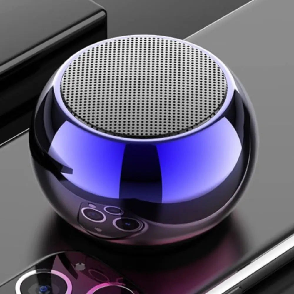 Round blue-lit metallic Dragon Mini True Wireless Bluetooth speaker for on-the-go audio