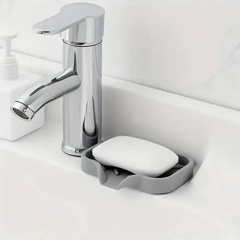 Chrome faucet and soap dish on a Drip-Free Silicone Sink Tray for your kitchen