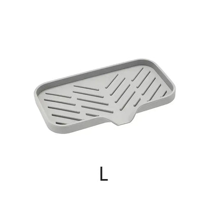 Gray slotted soap dish in a Drip-Free Silicone Sink Tray for kitchen sink use