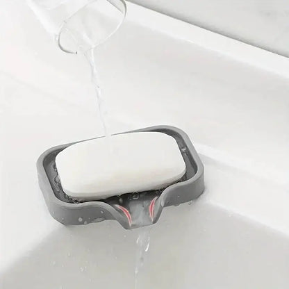 Gray soap dish with white bar soap on Drip-Free Silicone Sink Tray for kitchen use