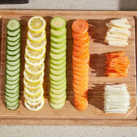 Easy-to-Clean Orange and White Mandoline Slicer for Quick Veggie Prep - Estalios