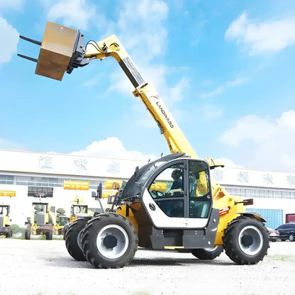 Yellow high efficiency telehandler in Europe lifting a box for agriculture tasks