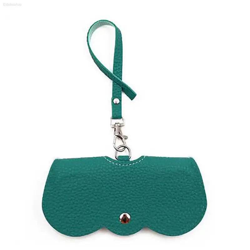 Teal leather glasses case with wrist strap.