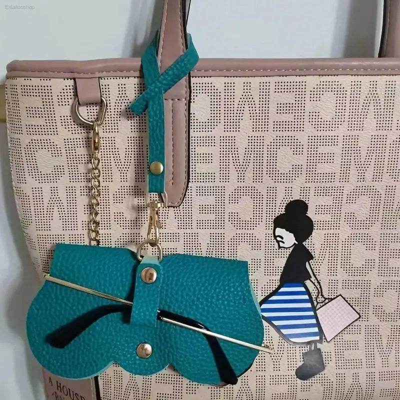 Beige tote bag with teal glasses case.