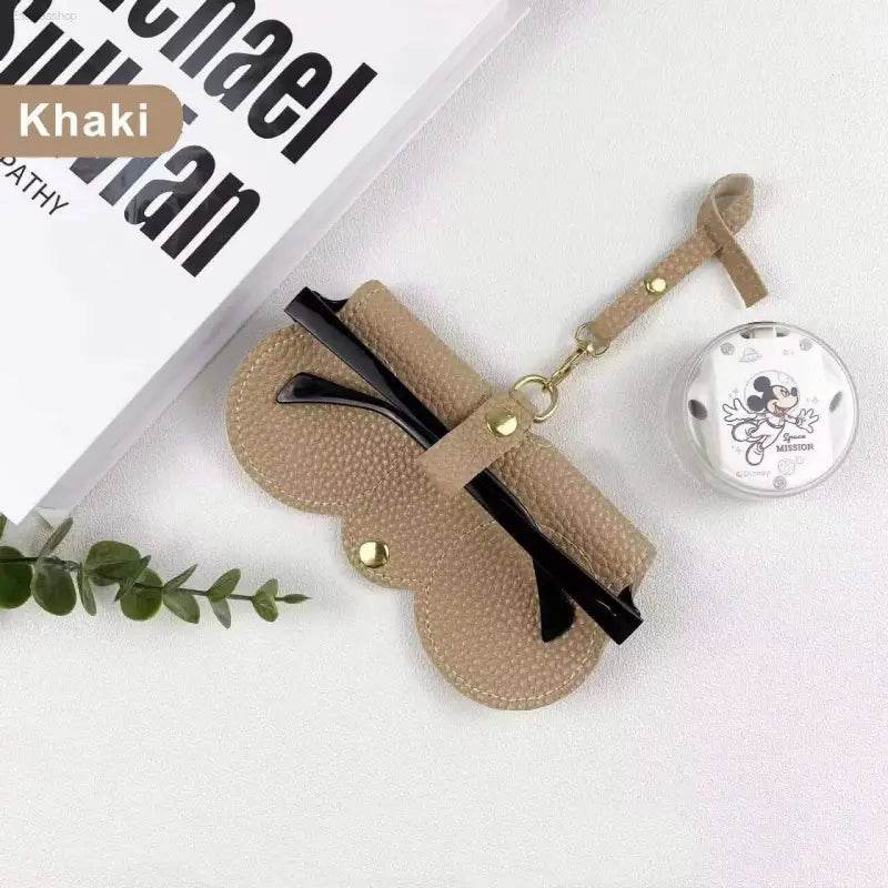 Khaki leather glasses case with strap.