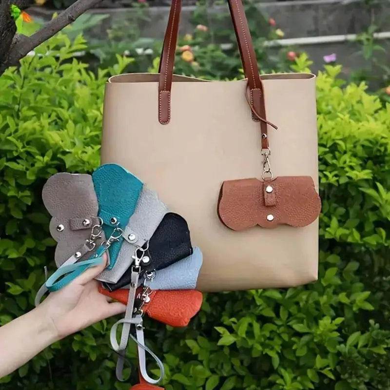 Beige tote bag with colorful eyewear cases.