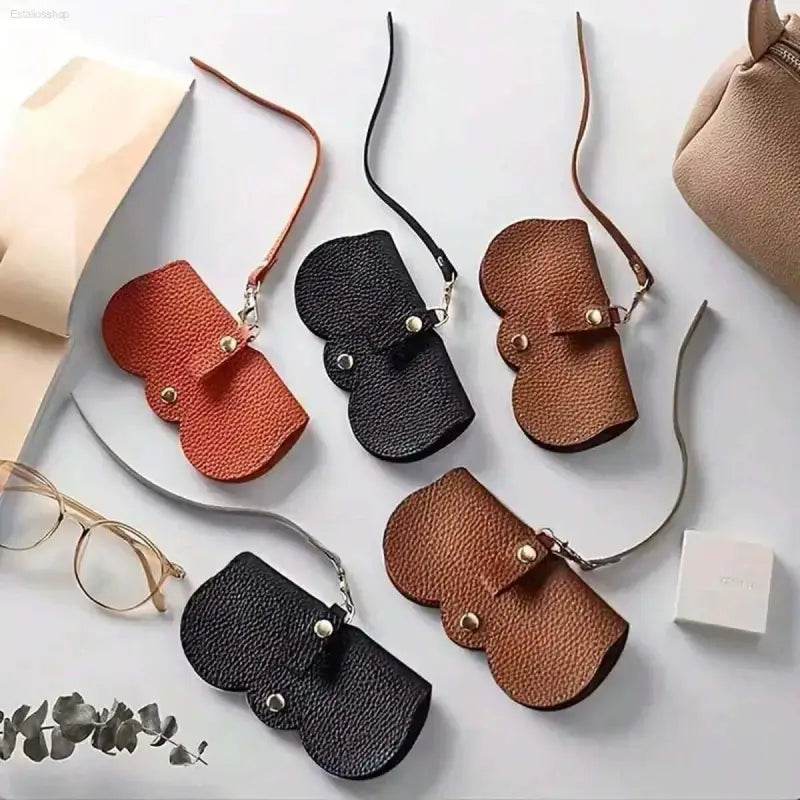 Leather glasses cases with straps.