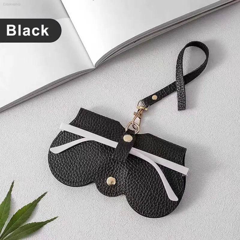Black leather glasses case with strap.