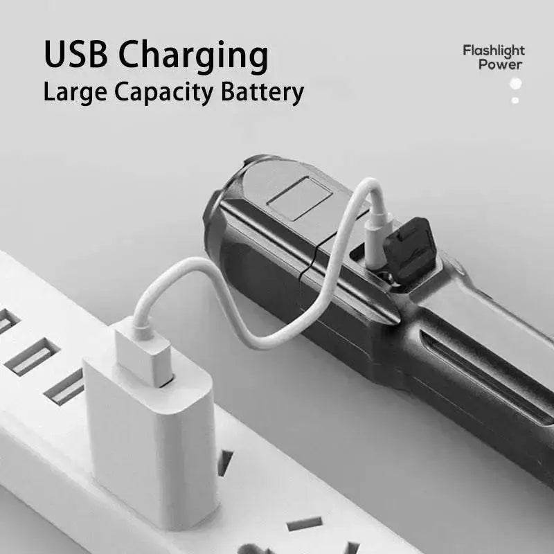 Rechargeable F15-T Black flashlight charging, highlighting strong light focusing features