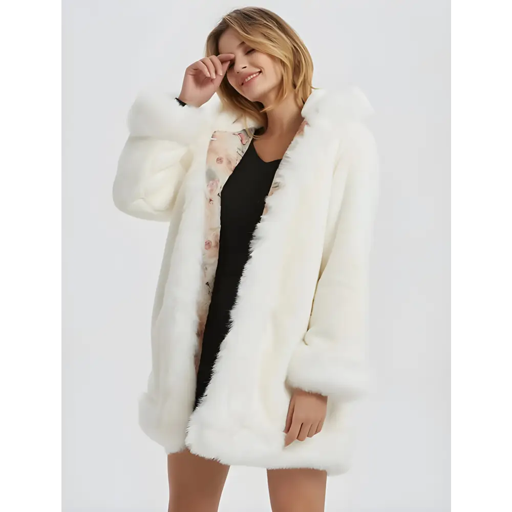 Woman in a chic hooded faux fur coat with a stylish faux fur collar