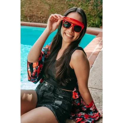 Smiling woman in sunglasses and floral kimono showcasing Flipside Sunglasses variant total