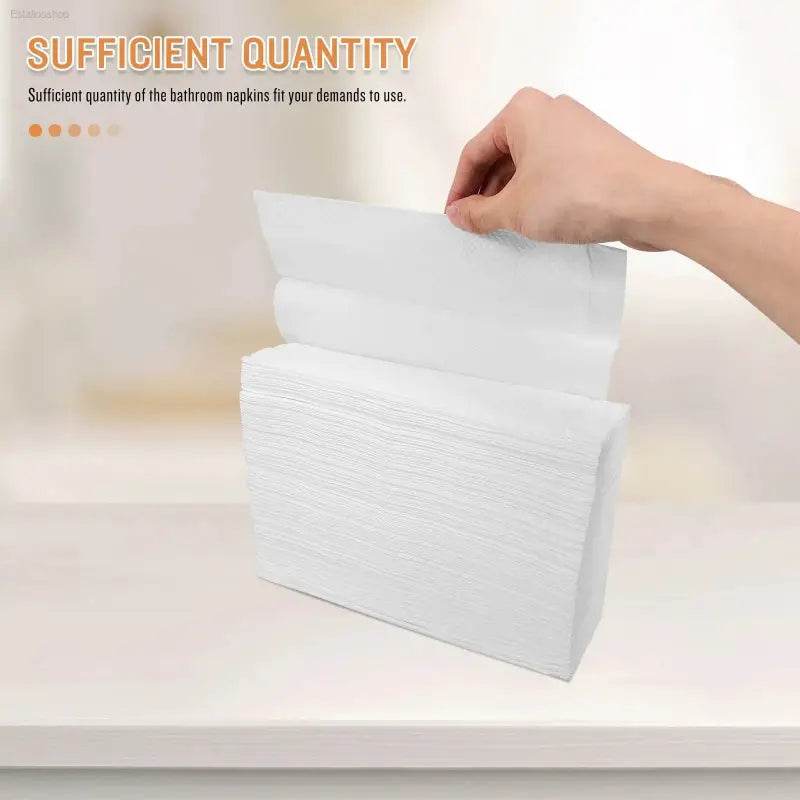 Stack of white paper towels.