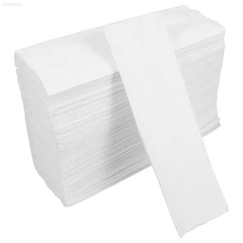 Stack of white paper towels.