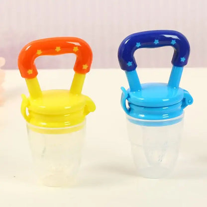 Two colorful Fresh Food Nibbler baby pacifiers feeders for your little one