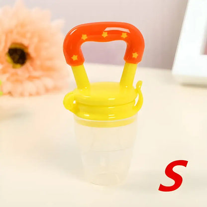 Fresh Food Nibbler Baby Pacifiers Feeder with a bright orange handle for easy use