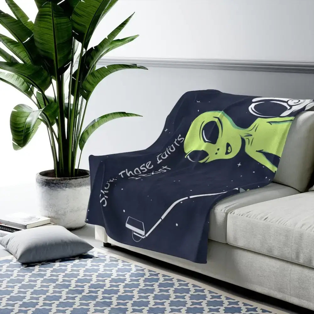 Cozy up with a Funny Alien & Astronaut Velveteen Plush Blanket for out-of-this-world fun