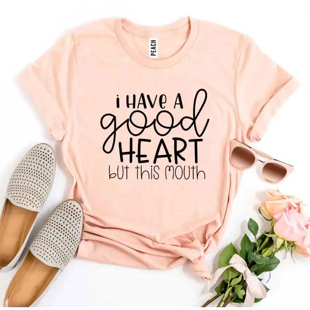 Peach-colored t-shirt with a sassy saying from Funny Tees Heather Gray Sold collection