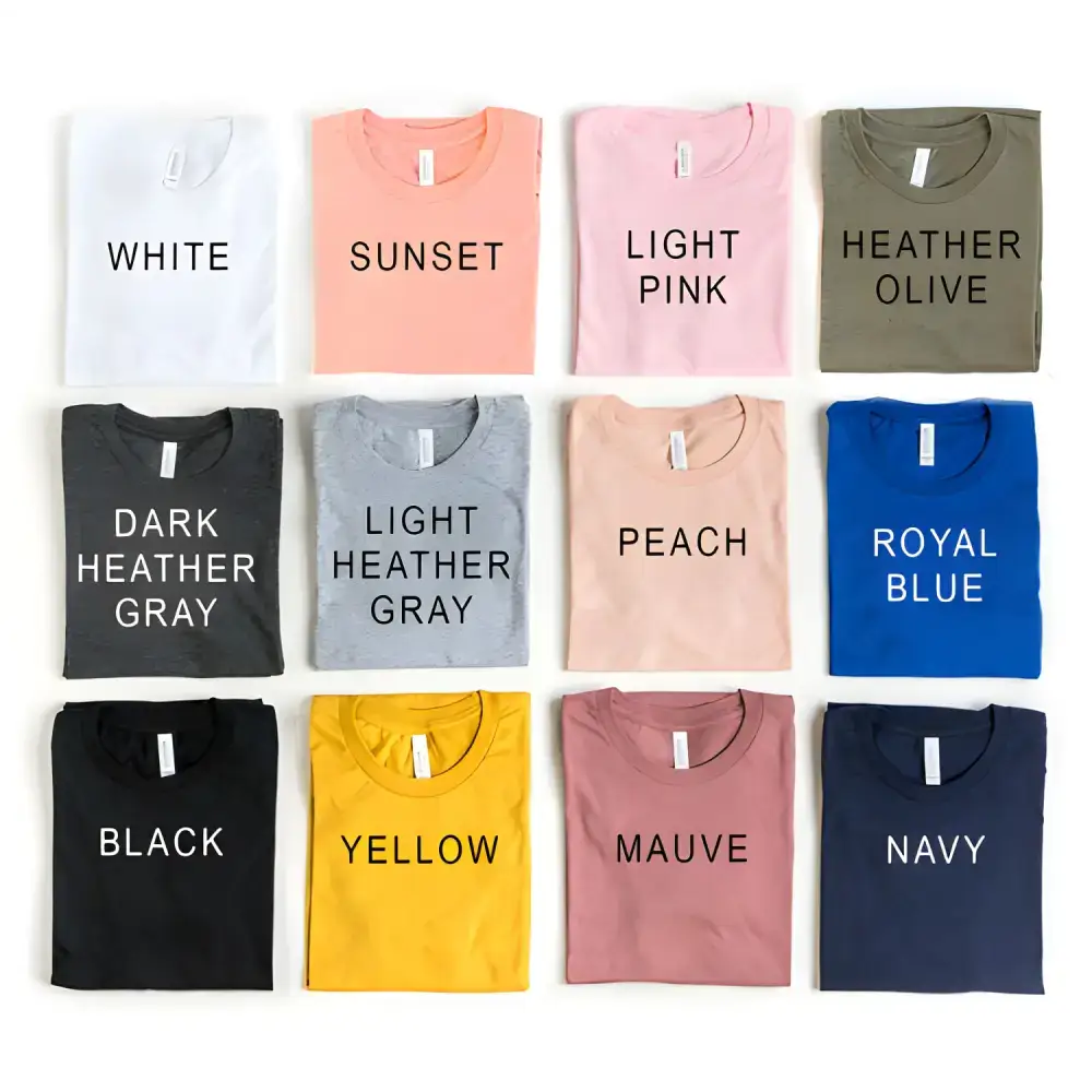 Folded t-shirts in various colors, featuring Heather Gray Sold and Light Pink Sold