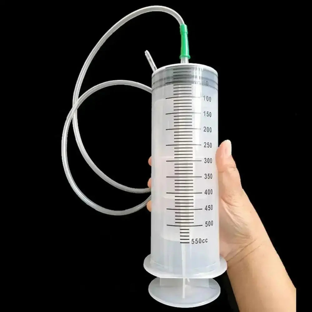 Large plastic syringe with tubing for easy use in large capacity syringes and oil pumps