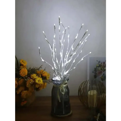 Illuminated white birch branch lights in a stylish vase for cozy home decor