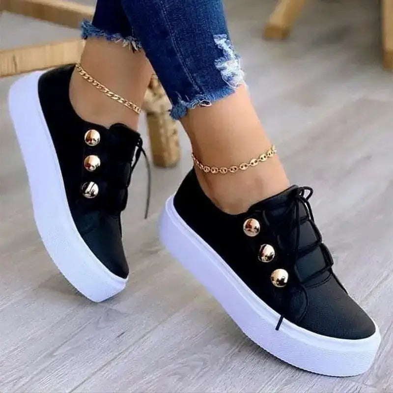 Black platform sneakers with gold buttons, perfect female running shoes for casual style