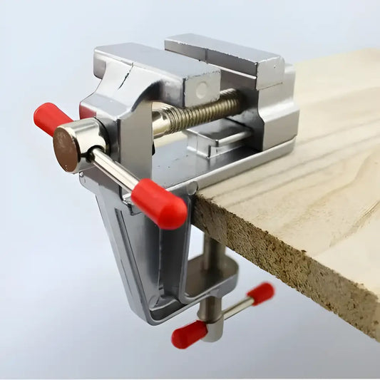 Silver aluminum miniature bench vise with red handles, perfect for multitasking projects