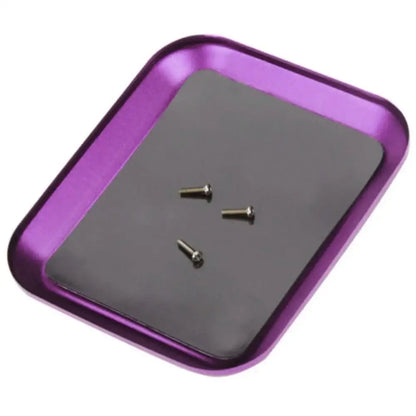 Photo of a purple aluminium magnetic screw tray with screws, perfect repair tool