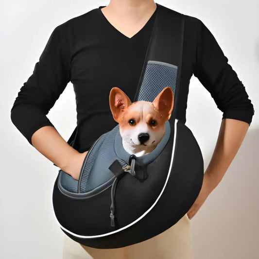 Dog happily snuggled in a sling carrier, perfect for the Grab Your Pets Bag Women