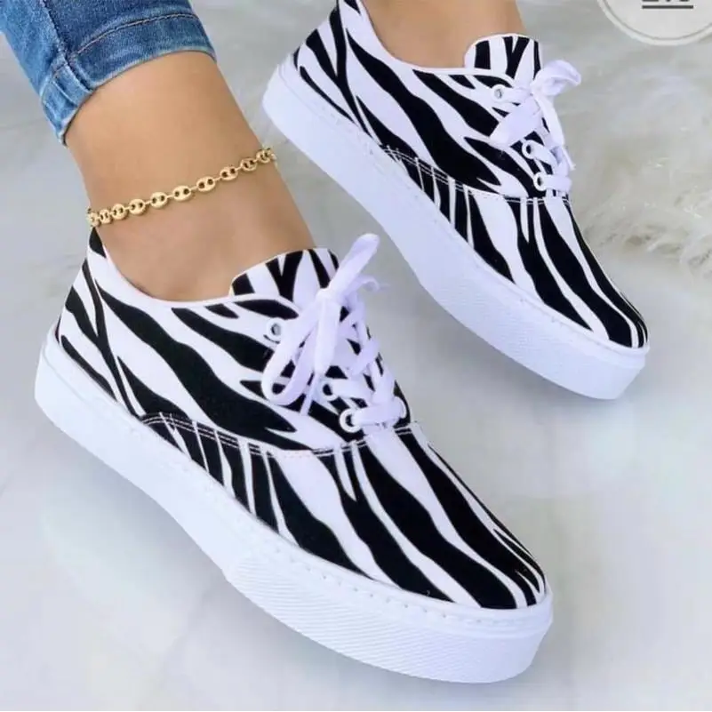 Zebra-striped canvas sneakers from Graffiti Women Sneakers for funky fashion vibes