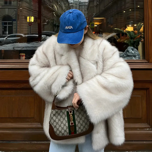 Woman in a Gray Gradient Coat Glam with a fur coat and Gucci bag style