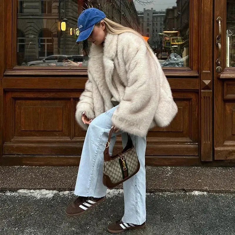 Woman rocking a Gray Gradient Coat Glam with jeans and sneakers for a chic look