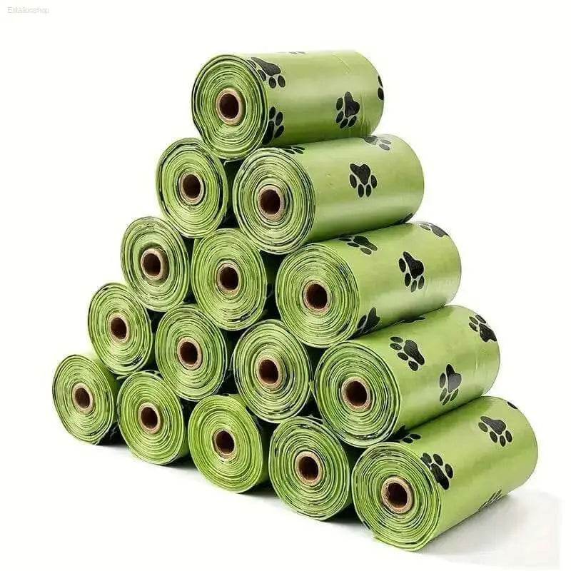 Pyramid of green dog waste bag rolls with paw prints.