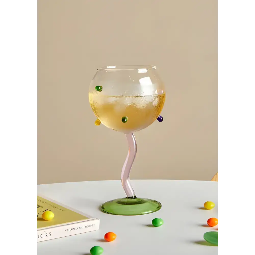 Whimsical hand blown rainbow sprinkles wine glasses with colorful accents