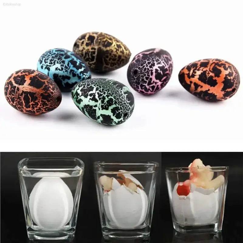 Cracked dinosaur egg toys and hatching process.