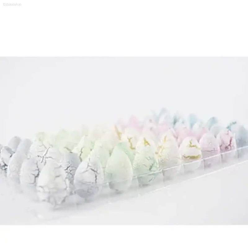 Pastel-colored, cracked, teardrop-shaped candies.